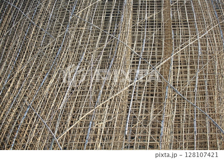 bamboo scaffolding pole cover the tower building wall cover the wan chai convention centre (HKCEE) , asian architectural background in hong kong china 128107421