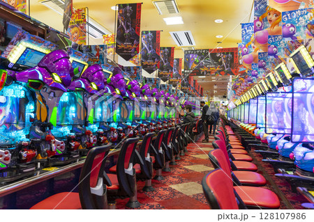 Okinawa, Japan - June 10,2019 : Unidentified people plays an arcade machines in Jumbo Pachinko Arcade in Naha, Okinawa, Japan on June 10,2019. 128107986