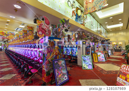 Okinawa, Japan - June 10,2019 : Unidentified people plays an arcade machines in Jumbo Pachinko Arcade in Naha, Okinawa, Japan on June 10,2019. 128107989