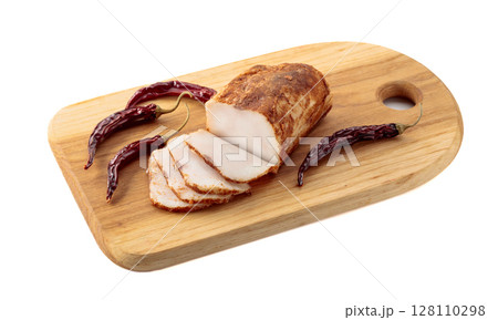 Salted lard with red pepper on a wooden cutting board. Salted lard with red pepper on a wooden cutting board. 128110298