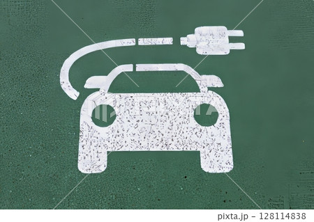 Electric cars are being charged at the designated parking symbol on the street Electric cars are being charged at the designated parking symbol on the street 128114838