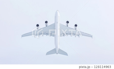 Aerial view of large passenger airplane flying in cloudy sky Aerial view of large passenger airplane flying in cloudy sky 128114963