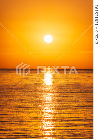Beautiful red and orange sunrise over the sea. Beautiful red and orange sunrise over the sea. 128115191