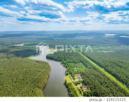 Aerial view of lake or river green shore with forest. Summer season. Aerial view of lake or river green shore with forest. Summer season. 128115225