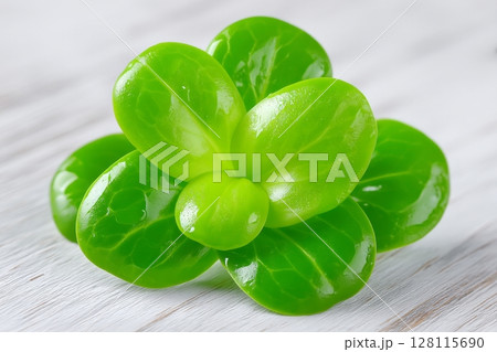 A close-up view of microgreen broccoli as it grows on a linen mat 128115690