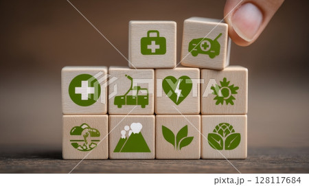 The idea of insurance for health is depicted as a hand holding a wooden block with an embedded medical healthcare icon 128117684
