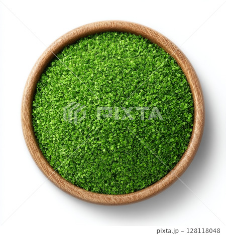 Mizuna sprouts, the cotyledons of Brassica juncea japonica, are found in a wooden bowl, with other names including Japanese mustard greens, kyona, and spider mustard, and are considered both a 128118048