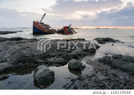 Old wrecked fishing boat on coast of Ang Sila Village, Saensuk Sub-district, Chonburi Province of thailand. Old wrecked fishing boat on coast of Ang Sila Village, Saensuk Sub-district, Chonburi Province of thailand. 128119588