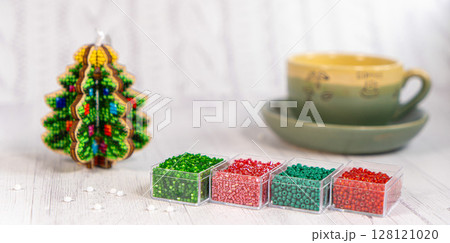 Colorful glass beads with christmas tree. Variety of shapes and colors to make a bead necklace or a string of beads for women 128121020