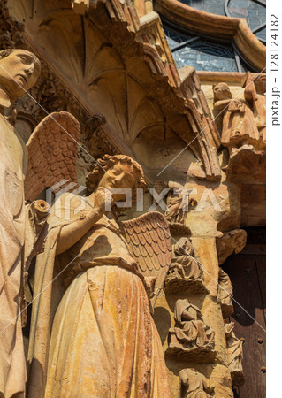 Smiling Angel, also known as the Smile of Reims or Angel of the Annunciation, is a stone sculpture at the Notre-Dame de Reims Cathedral, France Smiling Angel, also known as the Smile of Reims or Angel of the Annunciation, is a stone sculpture at the Notre-Dame de Reims Cathedral, France 128124182