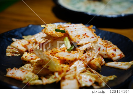 geotjeori, an unfermented Korean kimchi made with cabbage and a spicy chili pepper seasoning geotjeori, an unfermented Korean kimchi made with cabbage and a spicy chili pepper seasoning 128124194