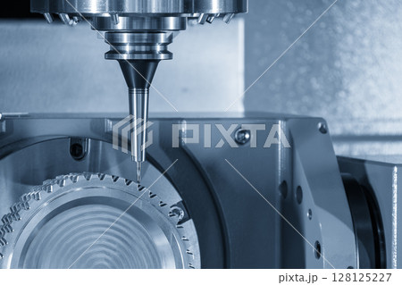 The 5-axis CNC milling machine cutting the gear part with solid ball nose end mill tools in the light blue scene. 128125227