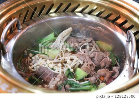 Sukiyaki ,suki or shabu pot and sliced beef or vegetable soup in the pot 128125300