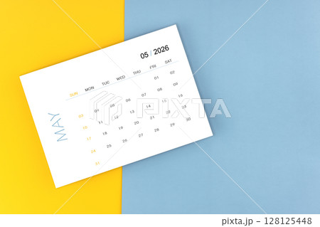 May 2026 calendar page on blue color background, Position with copy space. 128125448