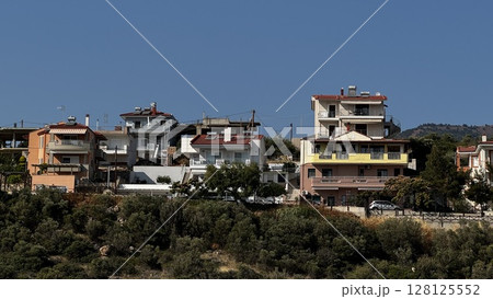Traditional Greek Homes on Elevated Hillside Traditional Greek Homes on Elevated Hillside 128125552