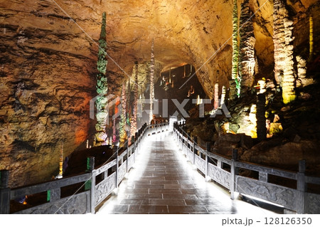 Zhangjiajie, Hunan Province, China - March 12, 2025: The beautiful interior of the Huanglong Cave in Zhangjiajie.ean landscapes within the cave. Zhangjiajie, Hunan Province, China - March 12, 2025: The beautiful interior of the Huanglong Cave in Zhangjiajie.ean landscapes within the cave. 128126350