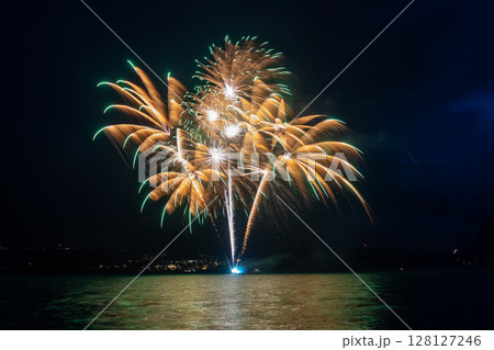 Fantastic fireworks at the Lake Thun during the Swiss National Day celebrations on August 1 in Gunten, Bern canton, Switzerland Fantastic fireworks at the Lake Thun during the Swiss National Day celebrations on August 1 in Gunten, Bern canton, Switzerland 128127246