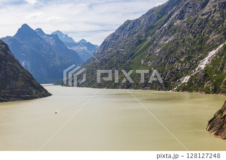 View of the artificial lake Grimselsee - hydroelectric reservoir for Grimsel Pass Dam in Bernese Oberland, Switzerland 128127248