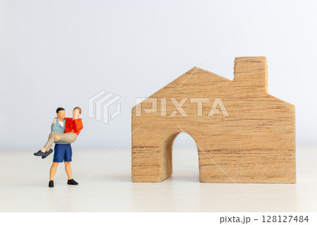 Miniature Couple Moving into New Home Together 128127484