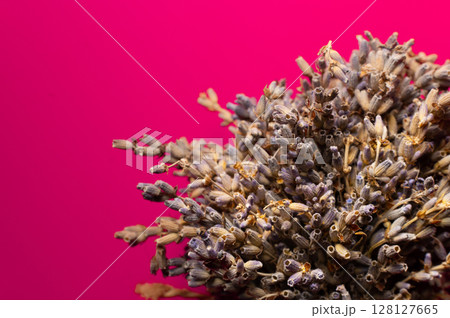 Small bouquet of dried lavender on pink background. Top view. Bouquet of dried lavender, aromatherapy Small bouquet of dried lavender on pink background. Top view. Bouquet of dried lavender, aromatherapy 128127665
