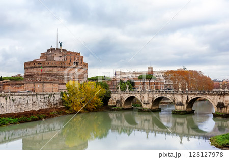 Castel Sant'Angelo and Ponte Sant'Angelo over the Tiber River against a dramatic autumn sky in Rome, Italy. Castel Sant'Angelo and Ponte Sant'Angelo in Rome, Italy. Castel Sant'Angelo and Ponte Sant'Angelo over the Tiber River against a dramatic autumn sky in Rome, Italy. Castel Sant'Angelo and Ponte Sant'Angelo in Rome, Italy. 128127978
