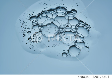 A drop of serum showing the texture of a cosmetic product. A drop of serum showing the texture of a cosmetic product. 128128401