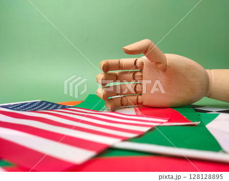 Hand shake with world wide flag country on a greem background. Geopolitical concept. 128128895