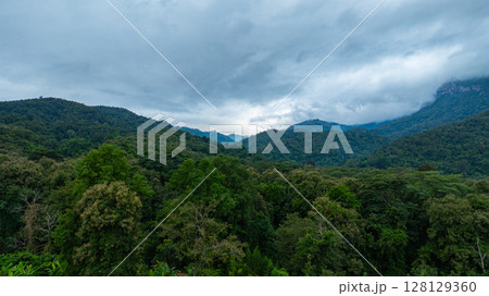 Aerial view of Cloud-Covered Mountain Peak 128129360