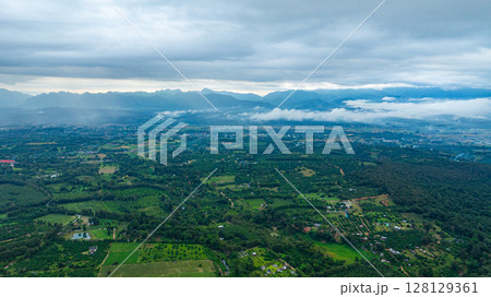 Aerial view of Cloud-Covered Mountain Peak Aerial view of Cloud-Covered Mountain Peak 128129361