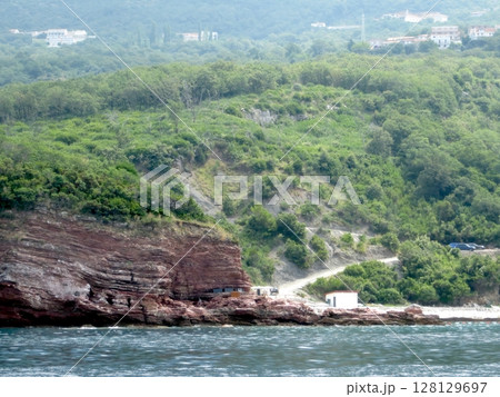 Rocky Coastal Landscape of Montenegro Along the Adriatic Sea With Lush Greenery and Winding Paths Rocky Coastal Landscape of Montenegro Along the Adriatic Sea With Lush Greenery and Winding Paths 128129697