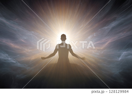 Meditative Enlightenment. Silhouette meditating with radiant light and ethereal atmosphere. 128129984