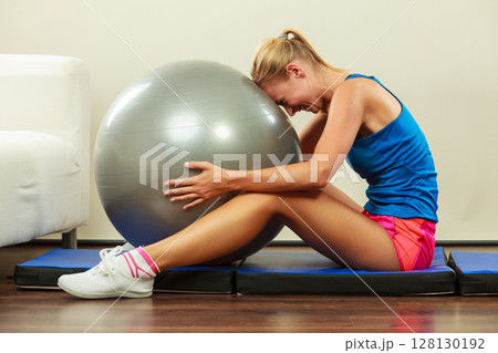 woman doing fitness exercises with fit ball woman doing fitness exercises with fit ball 128130192