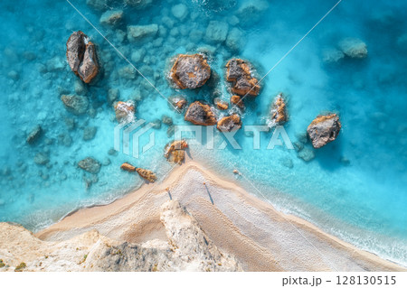 Aerial view of blue sea, rocks in clear water, white sandy beach 128130515