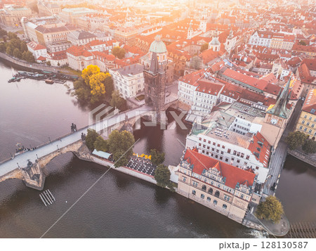Overlooking the Vltava River, Charles Bridge connects Old Town with Mala Strana, highlighted by the Old Town Bridge Tower. The stunning architecture defines Prague's historic skyline. Overlooking the Vltava River, Charles Bridge connects Old Town with Mala Strana, highlighted by the Old Town Bridge Tower. The stunning architecture defines Prague's historic skyline. 128130587