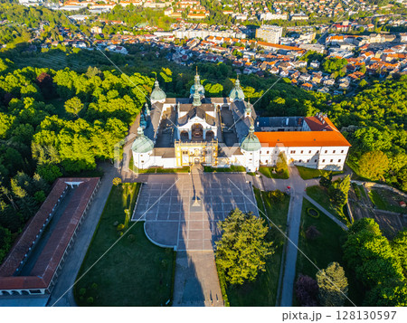 Holy Mountain in Pribram showcases an impressive Baroque complex, surrounded by lush greenery. Visitors find tranquility and spiritual reflection in this historic pilgrimage site in Czechia. 128130597