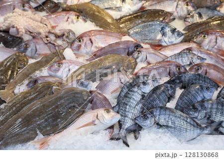 Vibrant displays of fresh fish and seafood in Greek fish market. Horizontal. Vibrant displays of fresh fish and seafood in Greek fish market. Horizontal. 128130868