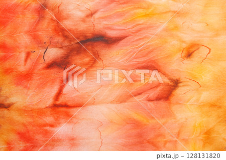 abstract pattern on silk fabric texture in yellow and brown tones 128131820