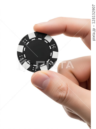 Hand holding single black poker chip isolated on transparent background, casino accessory, gambling token, poker night, high-value bet, gaming concept 128132907
