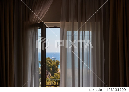 Apartment with sea view, open balcony door Apartment with sea view, open balcony door 128133990