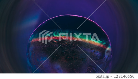 Ink spill. Colorful blend. Blur red purple neon round texture flowing blue droplets shimmer water floating on abstract dark black background. 128140556