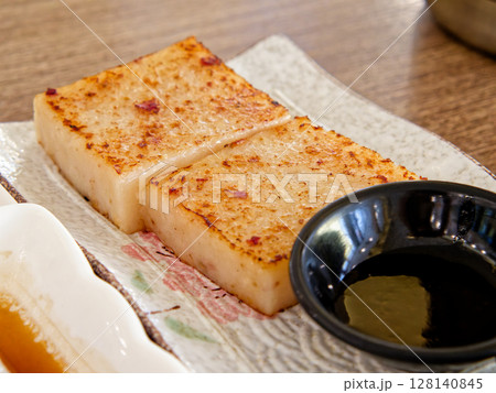 Pan-Fried Turnip Cake. Crispy edge, soft savory radish cubes Pan-Fried Turnip Cake. Crispy edge, soft savory radish cubes 128140845