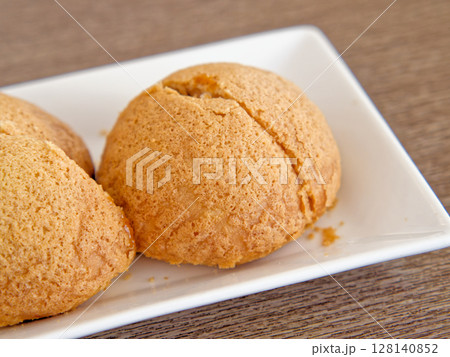 Cantonese Flaky Crust Char Siu Bun, Buttery crust, tender barbecued pork inside Cantonese Flaky Crust Char Siu Bun, Buttery crust, tender barbecued pork inside 128140852