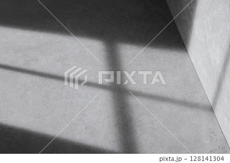 Concrete background that can be used in various designs with shadows of sunlight through the window. Concrete background that can be used in various designs with shadows of sunlight through the window. 128141304