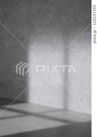 Concrete background that can be used in various designs with shadows of sunlight through the window. Concrete background that can be used in various designs with shadows of sunlight through the window. 128141305