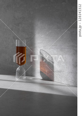 Concrete background that can be used in various designs with shadows of sunlight through the window. 128141312