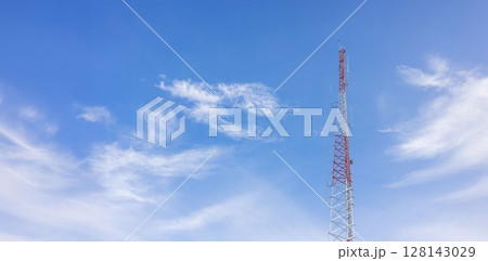 Telecommunication tower against blue sky with digital wireless network and futuristic technology interface for 5G, internet, and global data connection concept. communication network. 128143029