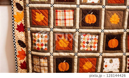 Patchwork quilt with autumn patterns. Fall decor concept 128144426