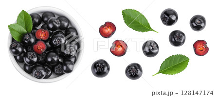 Chokeberry with leaf in a ceramic bowl isolated on white background. Black aronia. Top view. Flat lay Chokeberry with leaf in a ceramic bowl isolated on white background. Black aronia. Top view. Flat lay 128147174