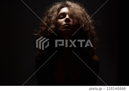 Beautiful Woman with curly Hair. Hairy Girl silhouette 128148886