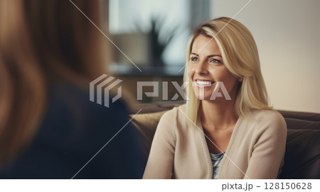 Visit to a psychologist. Woman sits on a couch and talks to a psychotherapist. 128150628